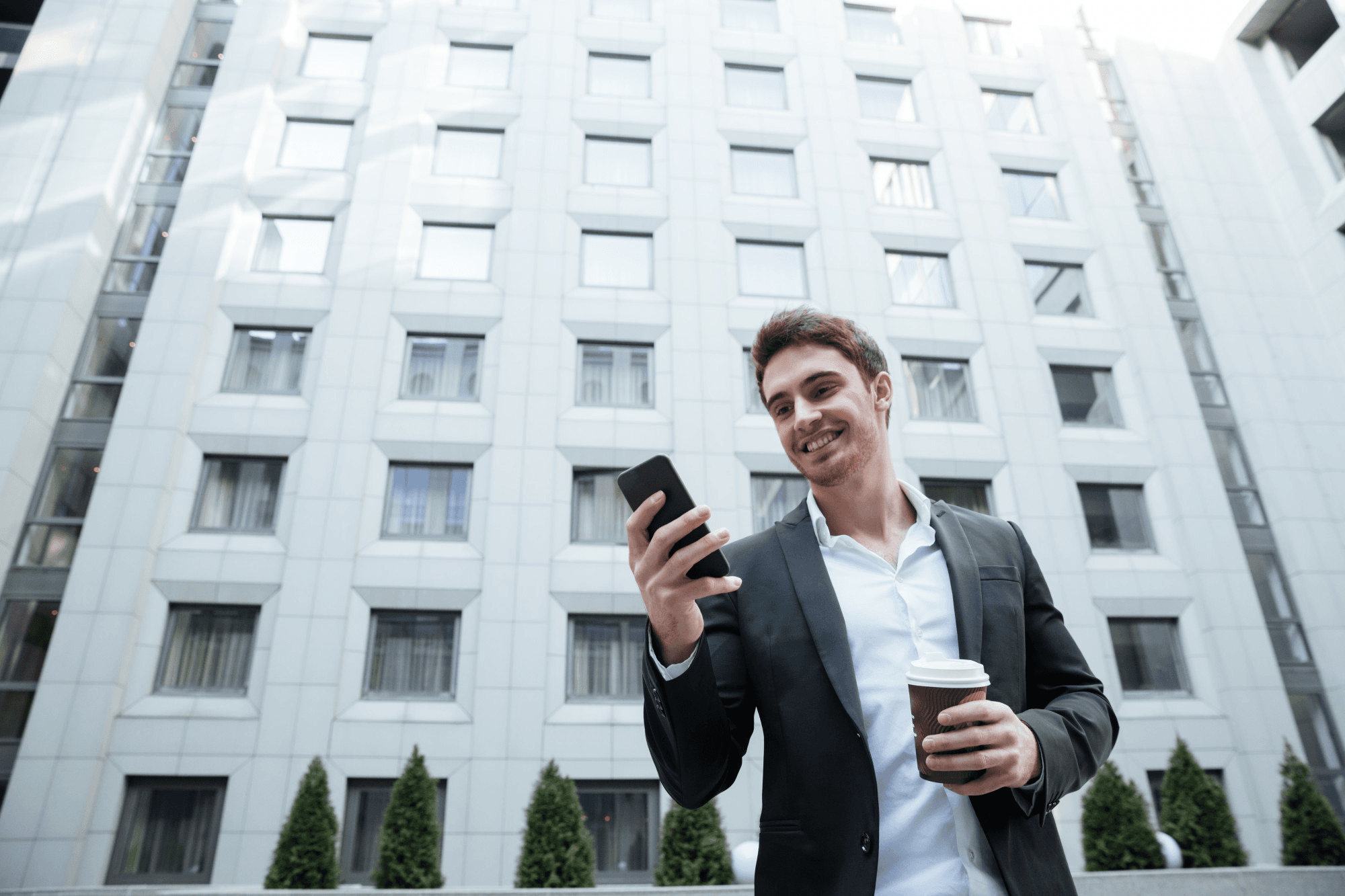 Resident with phone outside an Alberta rental